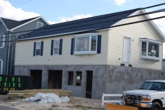 A house being raised following Superstorm Sandy damage. (Photo: Daniel Nee)