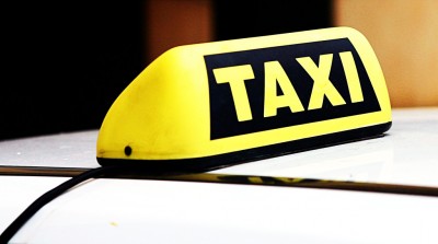 A taxicab sign. (Photo:  Leonid Mamchenkov/Flickr)