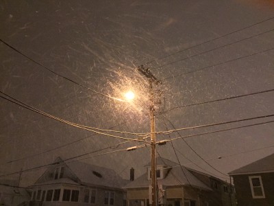 Snowflakes blowing Saturday night under a street lamp. (Photo: Daniel Nee)