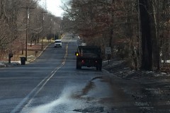 A crew fills pot holes on a road in Wall Township. (Photo: Daniel Nee)