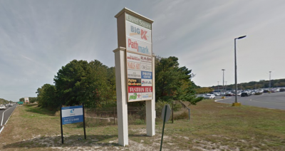A sign advertises commercial leasing at the Laurel Square shopping center.