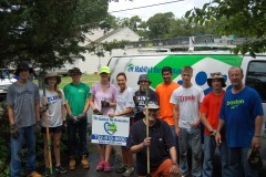 Volunteers with Northern Ocean Habitat for Humanity help spruce up a yard in Brick. (Photo: Daniel Nee)