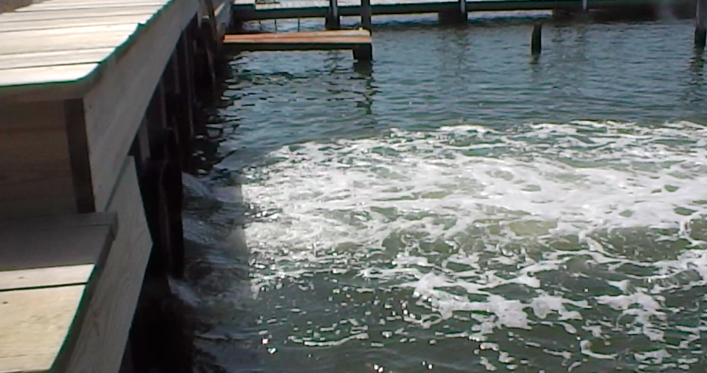 Water flows into Barnegat Bay from a pump at Lyman Avenue in Mantoloking. (Photo: Daniel Nee)
