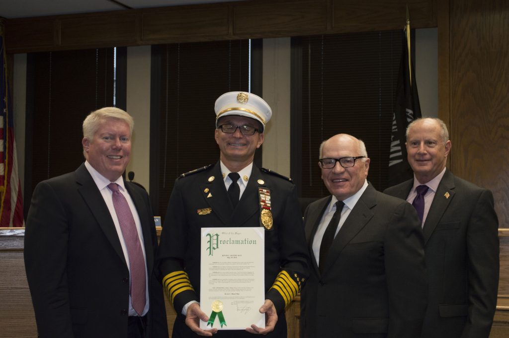 Kevin Batzel is honored by Mayor John Ducey and township council members. (Photo: Daniel Nee)
