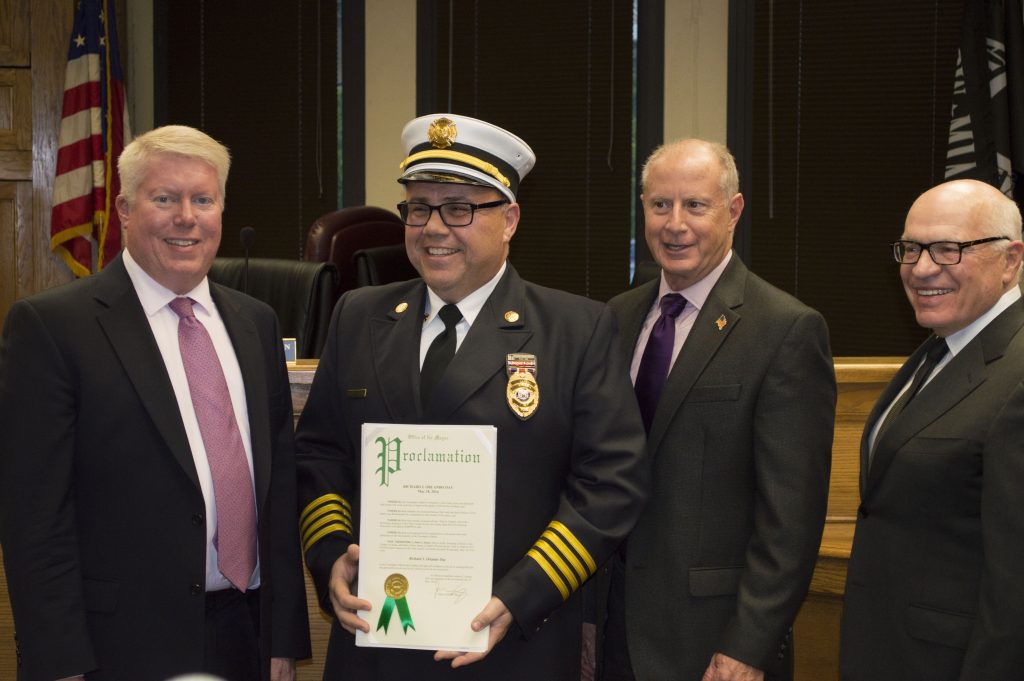 Rich Orlando is honored by Mayor John Ducey and township council members. (Photo: Daniel Nee)
