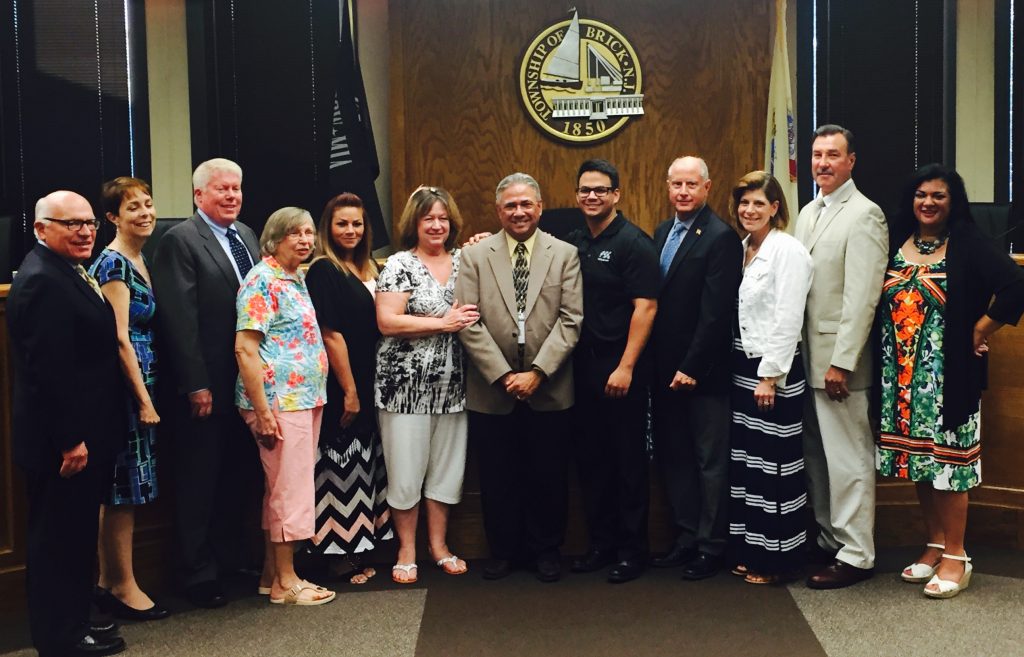 Scott Pezarras, joined by his family and Brick officials. (Photo: Daniel Nee)