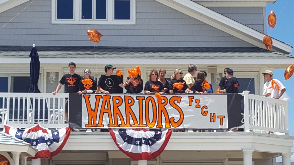 Family and friends of Matthew Dougard cheer on his flight over the ocean in Lavallette. (Photo: Kelly Dougard)