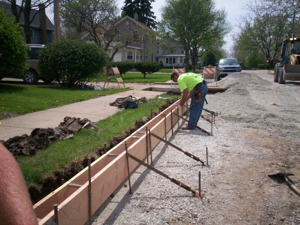 Curb installation. (Credit: Pam Broviak/Flickr)