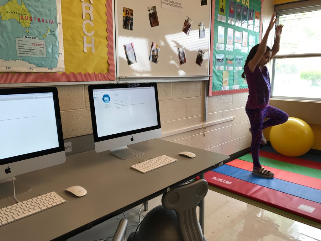 Sean Gilson, 9, shows off the mechanical device he made at Emma Havens Young Elementary School's 'movement' classroom. (Photo: Daniel Nee)