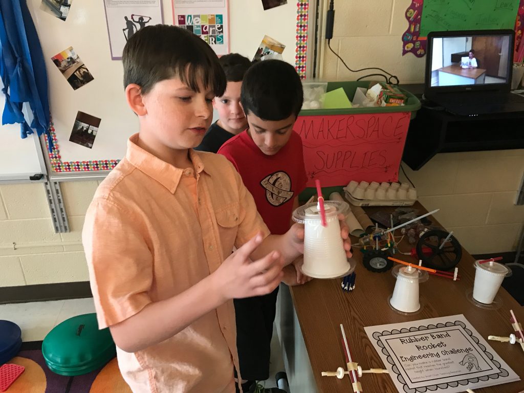 Sean Gilson, 9, shows off the mechanical device he made at Emma Havens Young Elementary School's 'movement' classroom. (Photo: Daniel Nee)