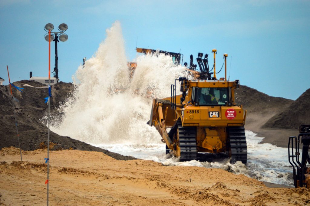 Sand is pumped onto Normandy Beach in Brick, N.J., June 4, 2018. (Photo: Daniel Nee)