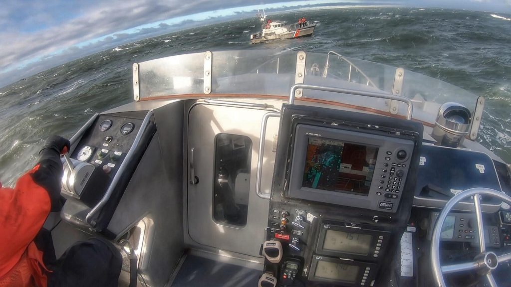 U.S. Coast Guard Station Manasquan Inlet members practice in heavy surf off Point Pleasant Beach. (Photo: USCG)