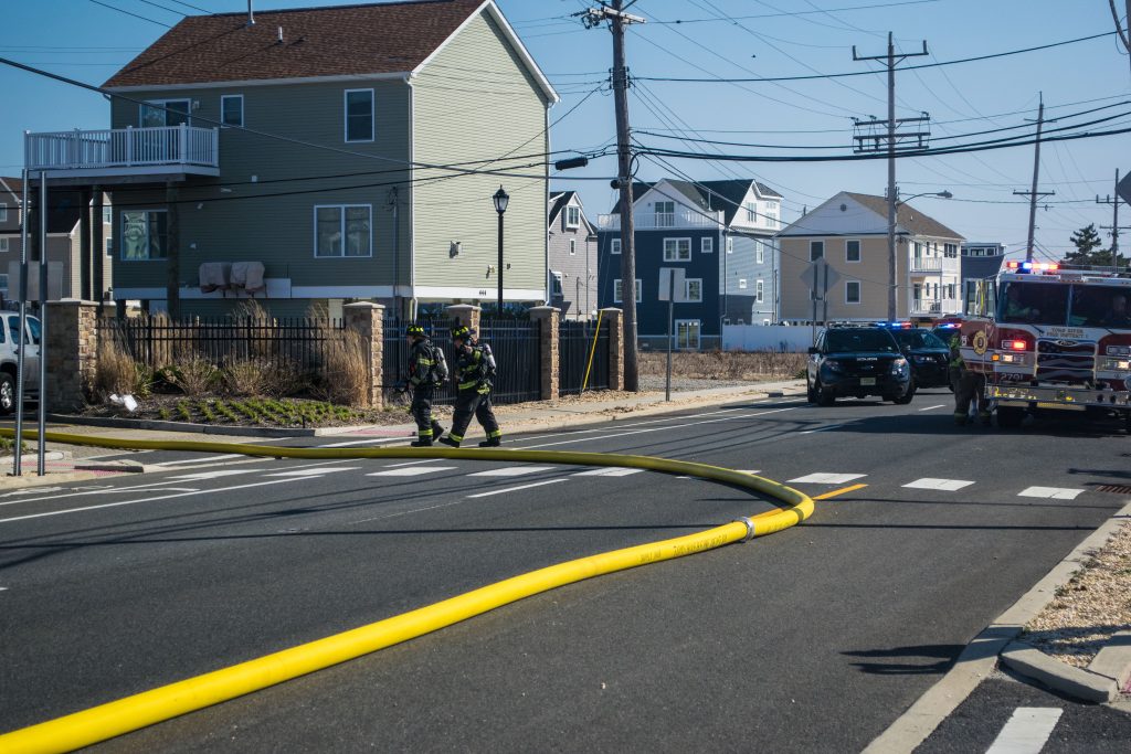 Firefighters respond to a four-alarm blaze at the Ocean Club condominium on Route 35 in Brick. (Photo: Daniel Nee)