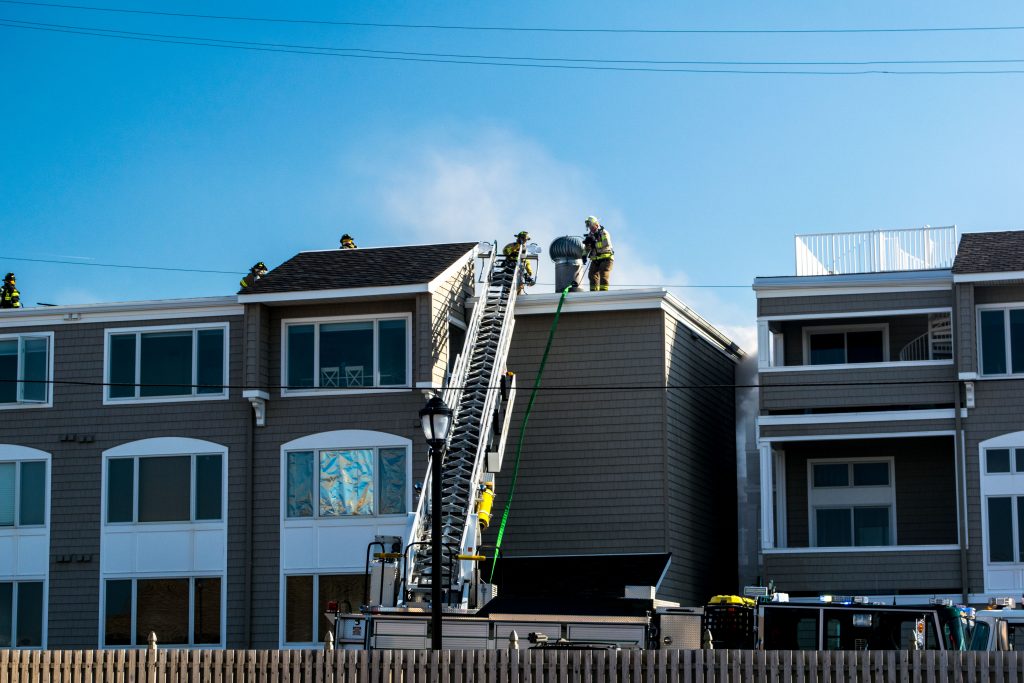 Firefighters respond to a four-alarm blaze at the Ocean Club condominium on Route 35 in Brick. (Photo: Daniel Nee)