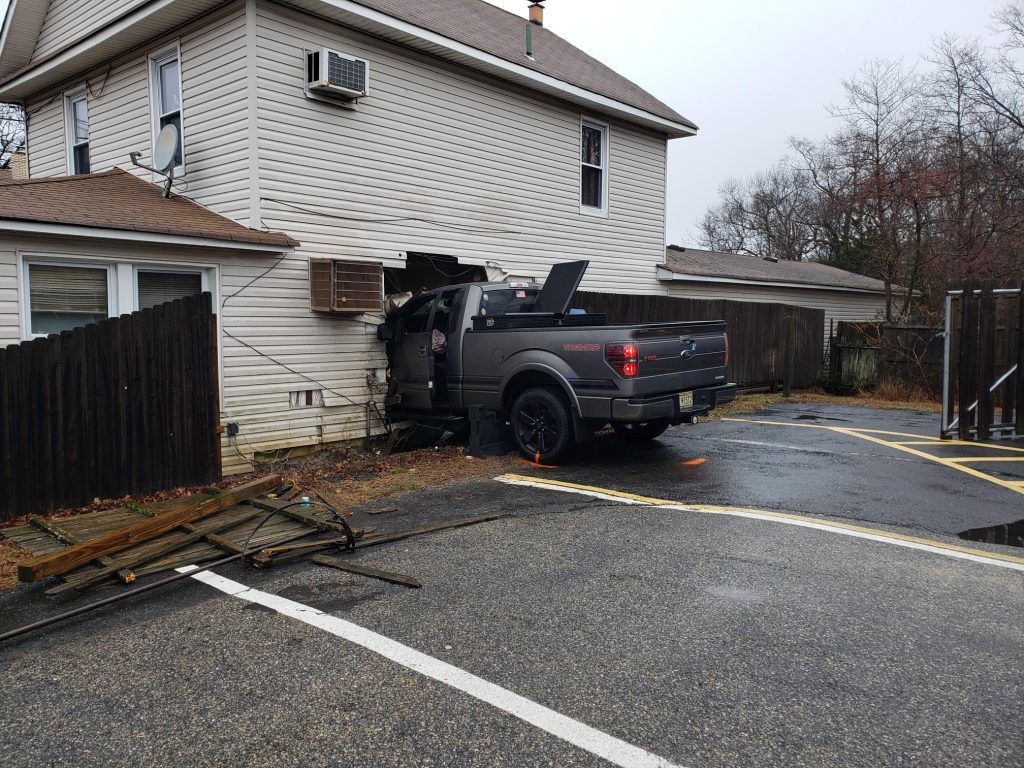 A truck crashes into a home at 372 Drum Point Road. (Photo: Brick Twp. Police)