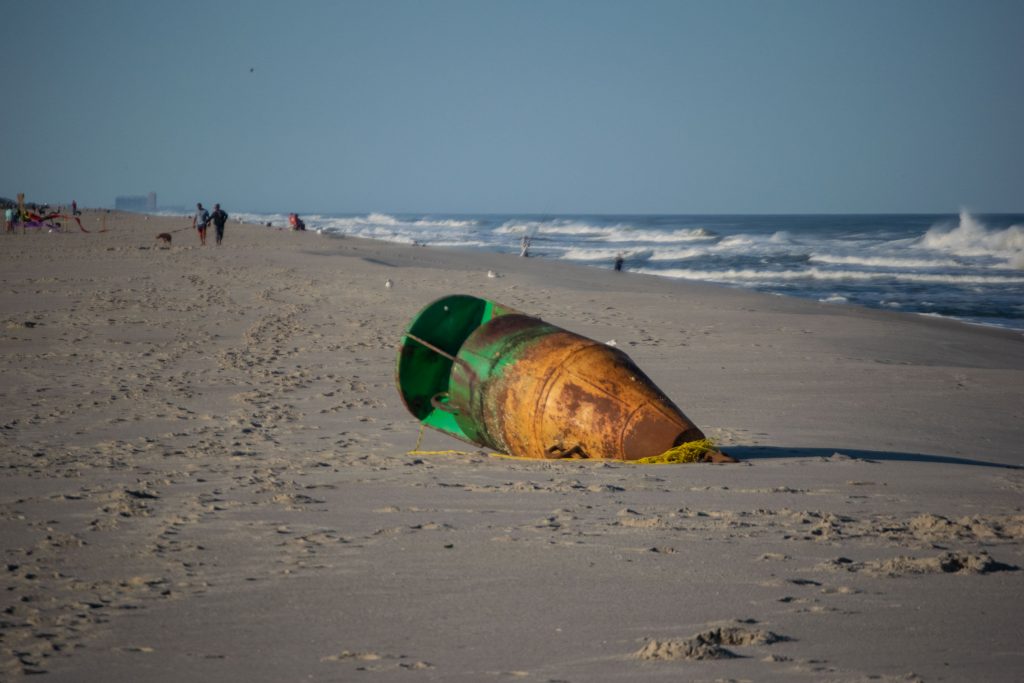 A green lateral buoy washed up on Brick Beach III, Sept. 22, 2020. (Photo: Daniel Nee)