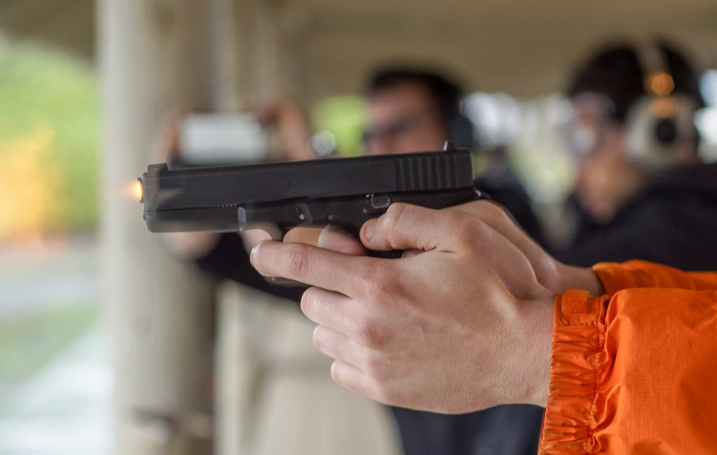 A gun being fired at a range. (Credit: Peretz Partensky/ Flickr)