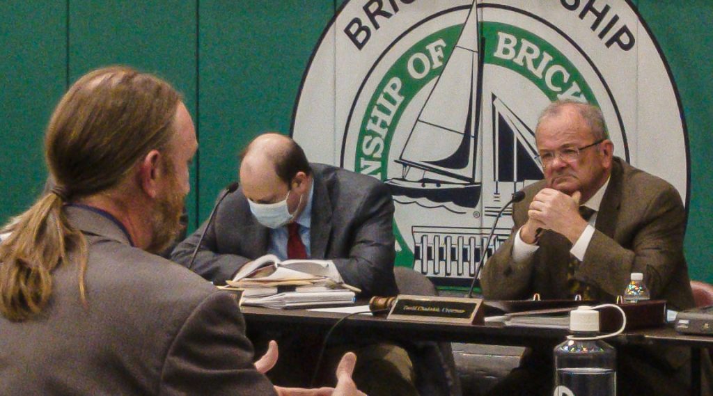 Professionals engage in a discussion at a hearing over a proposed private school in Brick, Dec. 20, 2021. (Photo: Daniel Nee)