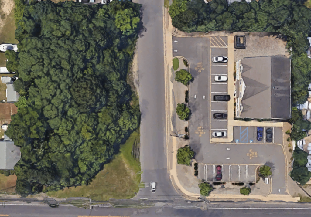 The property at 341 Drum Point Road, Brick, N.J. (wooded lot) where three homes are proposed. (Credit: Google Maps)