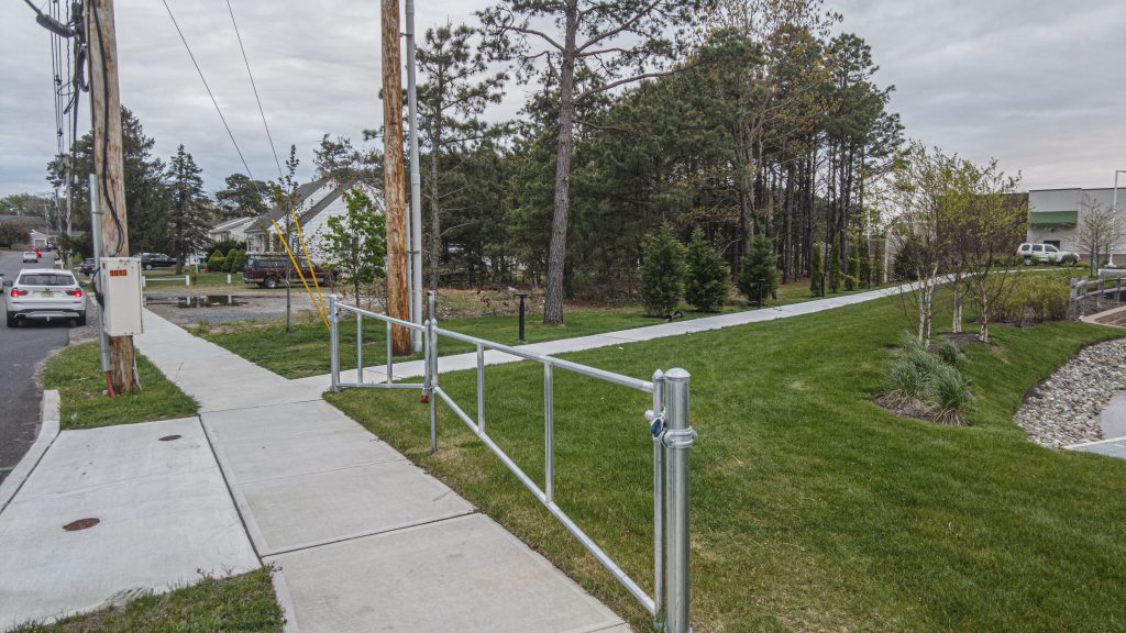 The area of a proposed entrance and egress from the Wawa shopping center on Route 70 and North Lake Shore Drive, Brick, N.J., May 2022. (Photo: Daniel Nee)