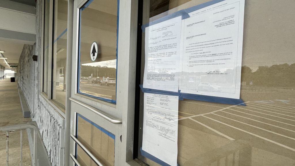 Eviction notices posted outside Corrado's Market, Brick, N.J., June 2022. (Photo: Daniel Nee)