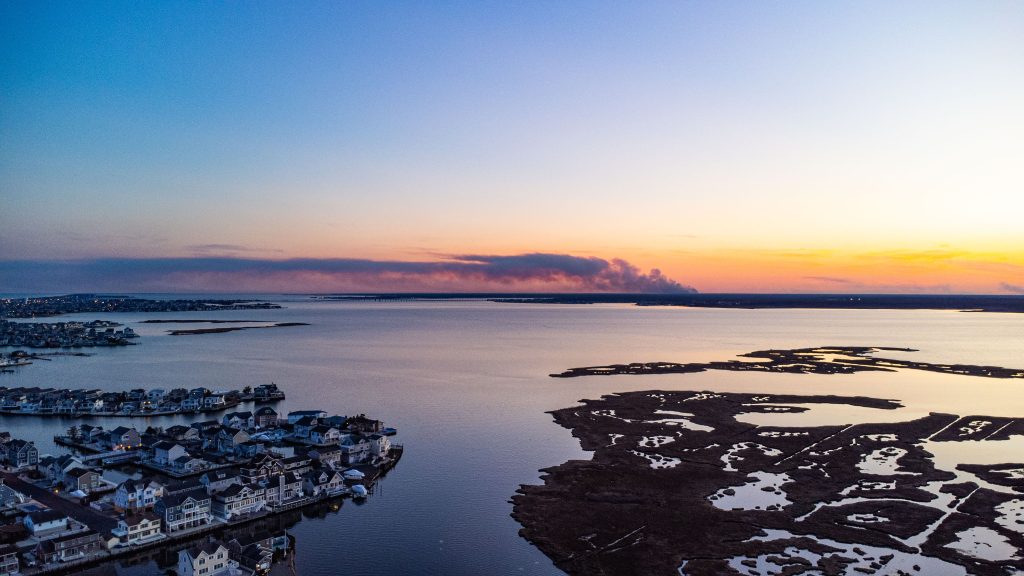 A controlled burn takes place March 6, 2023 in Lacey Township, as photographed from Normandy Beach. (Photo: Daniel Nee)