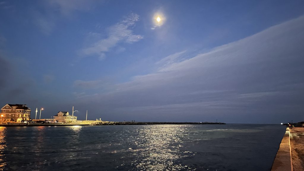 The moon (center) and Jupiter (left) over Manasquan Inlet. (Photo: Shorebeat)